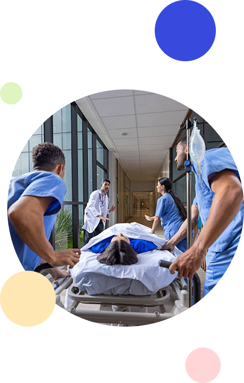 Healthcare team rushing a patient through a hospital corridor